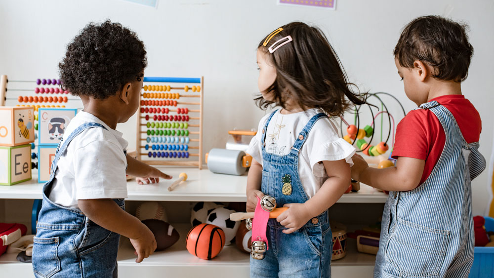 Young children playing with educational toys